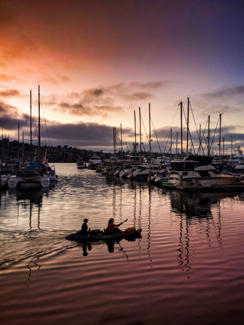 Kayakers and Reflections in marina sunset at Island Palms Best Western San Diego California 1